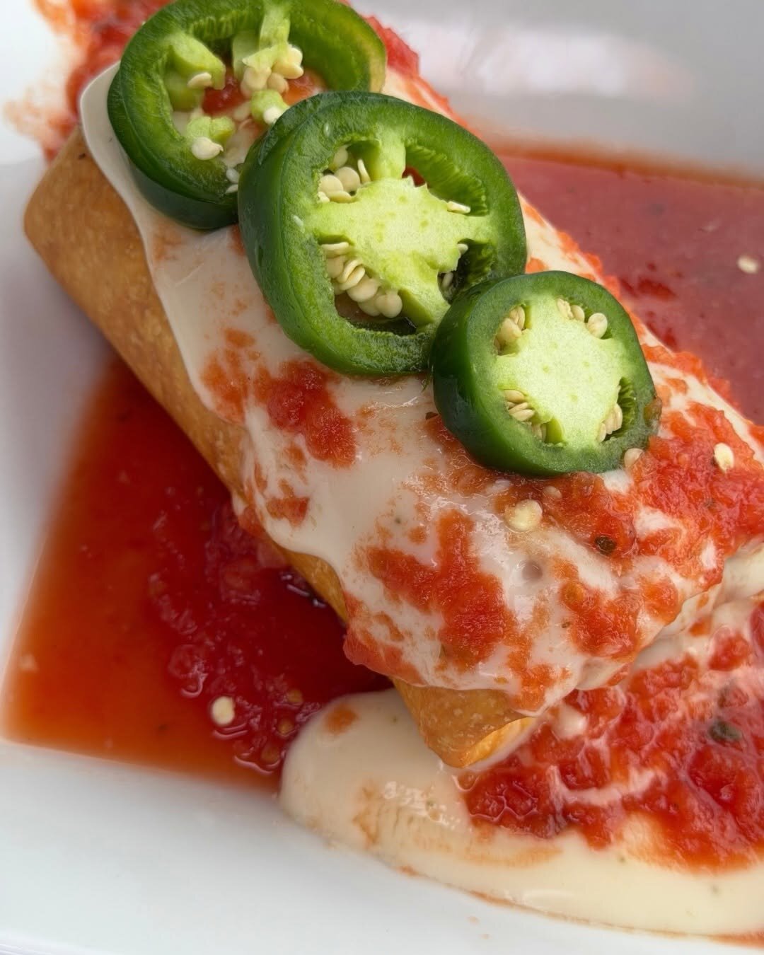 A chimichanga with queso and jalapeño