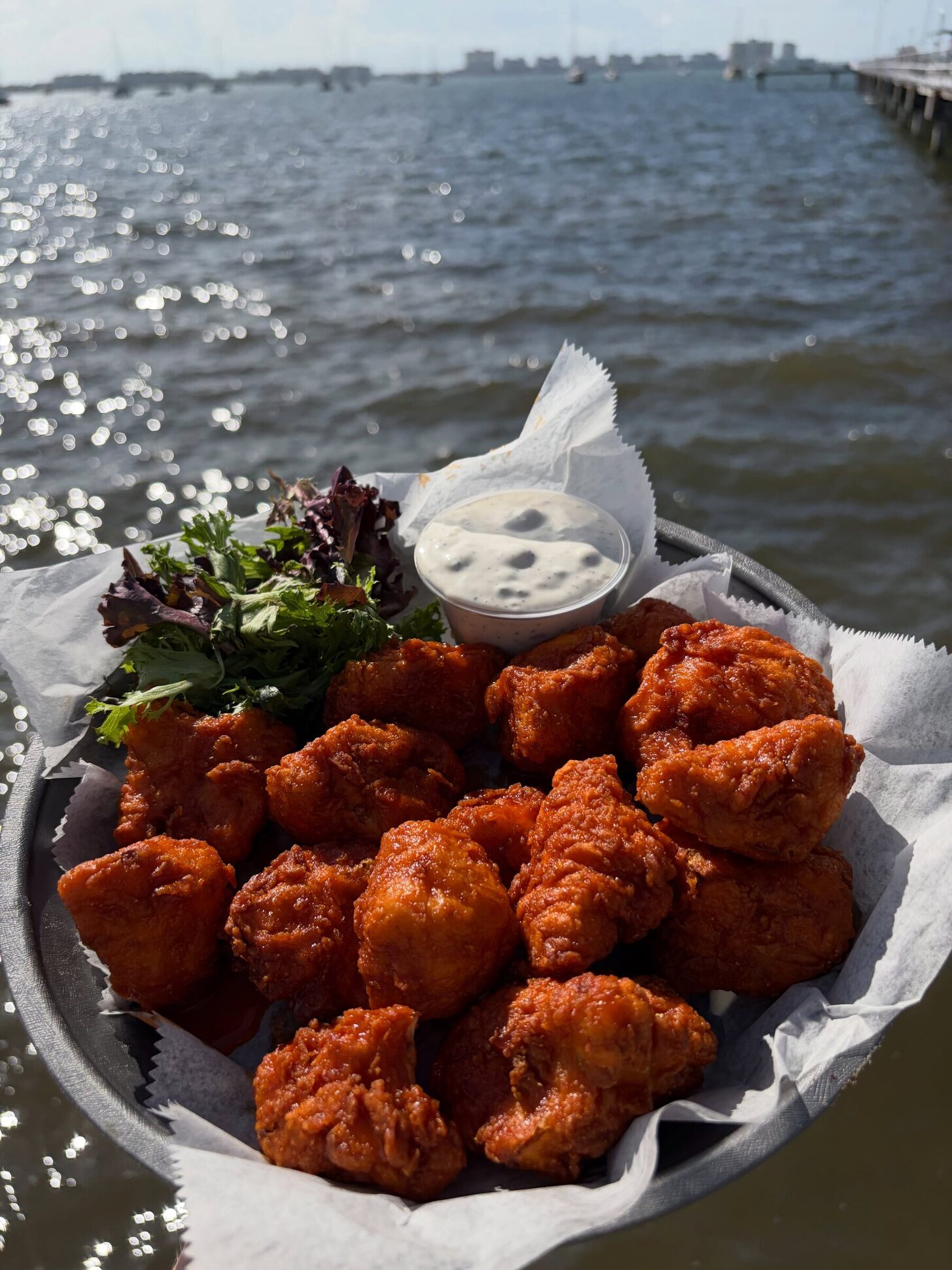 Wings in a basket over the bay