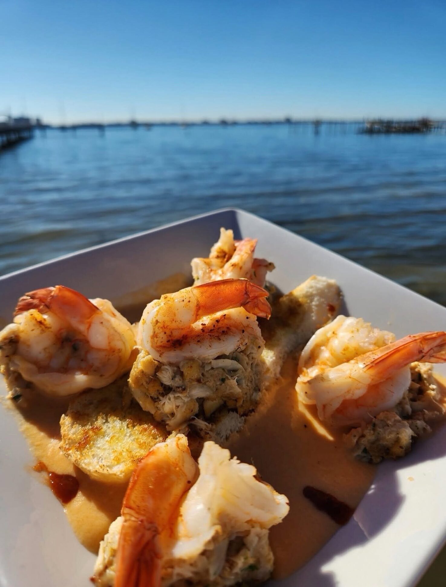 Crab-stuffed shrimp, one of Chef Ronnie's features, against the bay