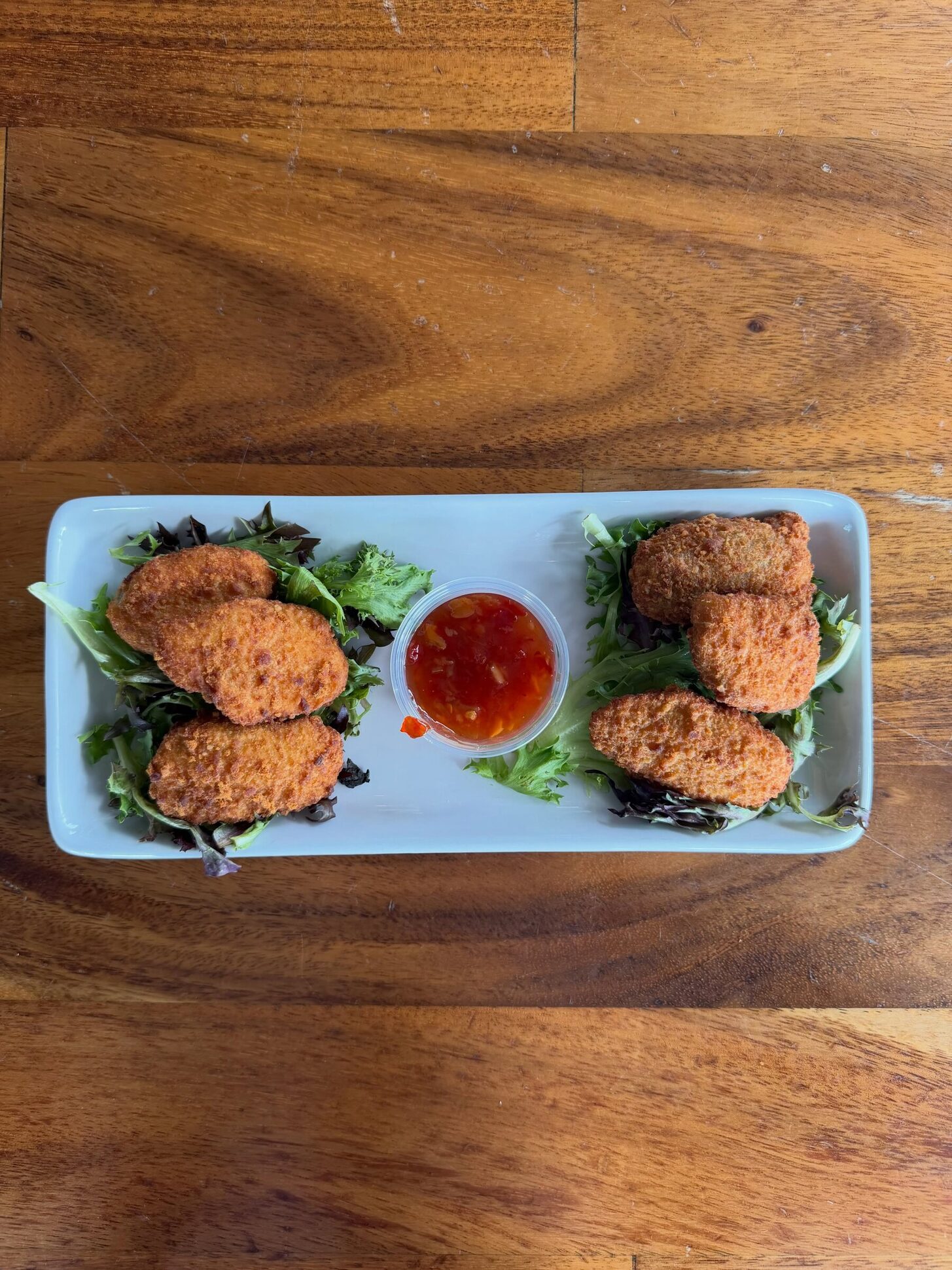 Ronnie's crab cakes on a wood table