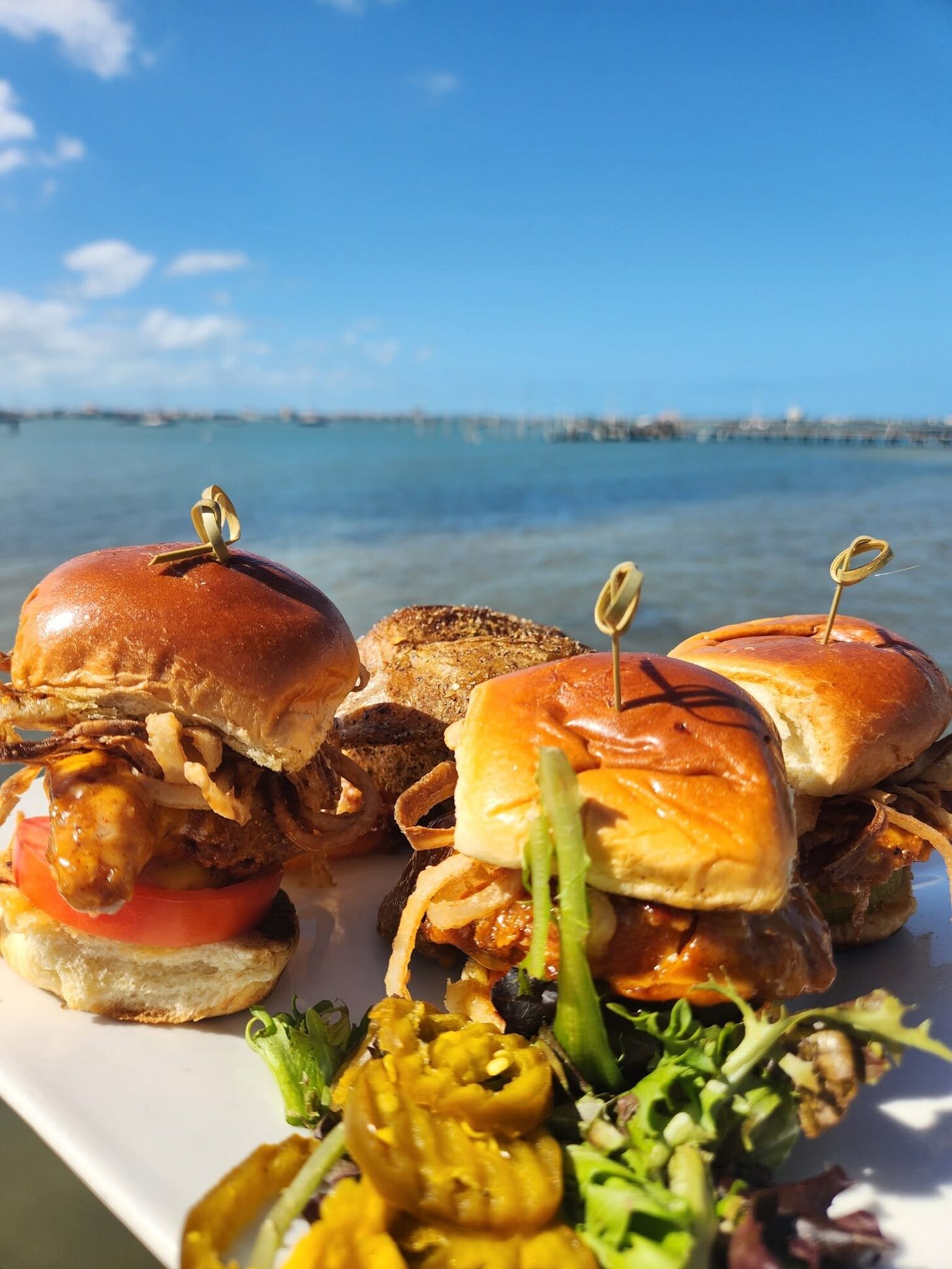 A tray of sliders on the O'Maddy's rail against the bay