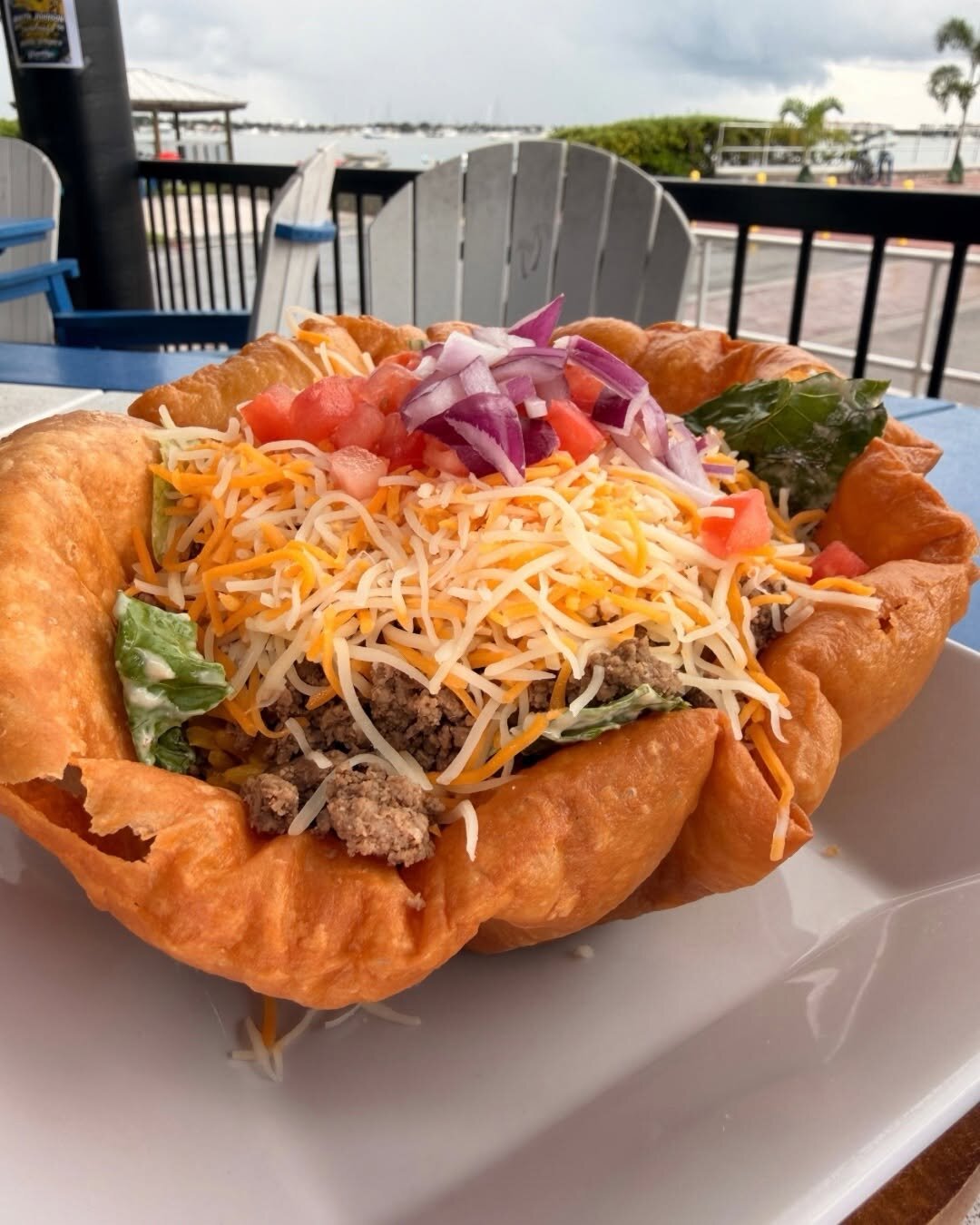 A taco salad in a tortilla bowl