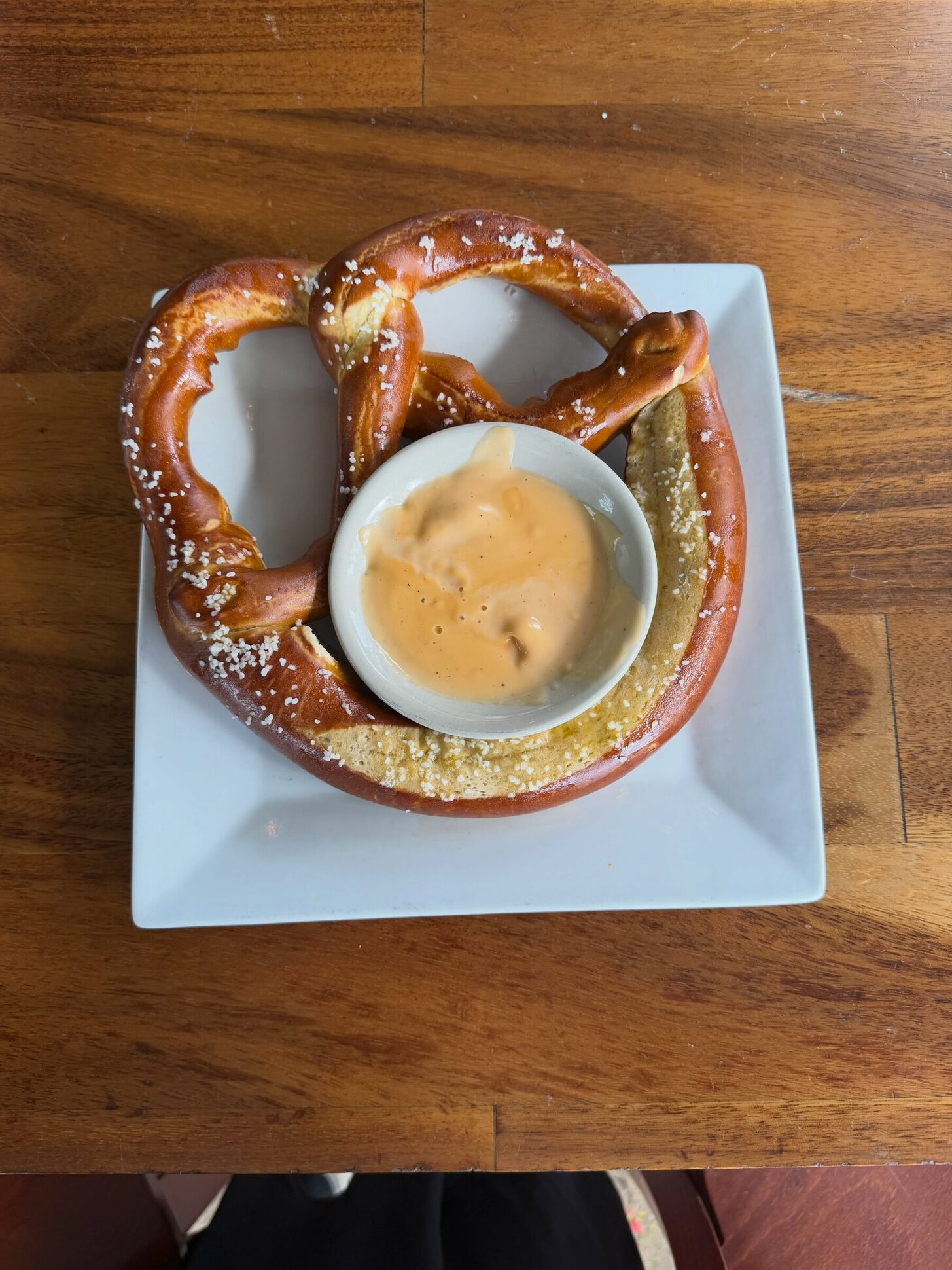A soft pretzel with beer cheese