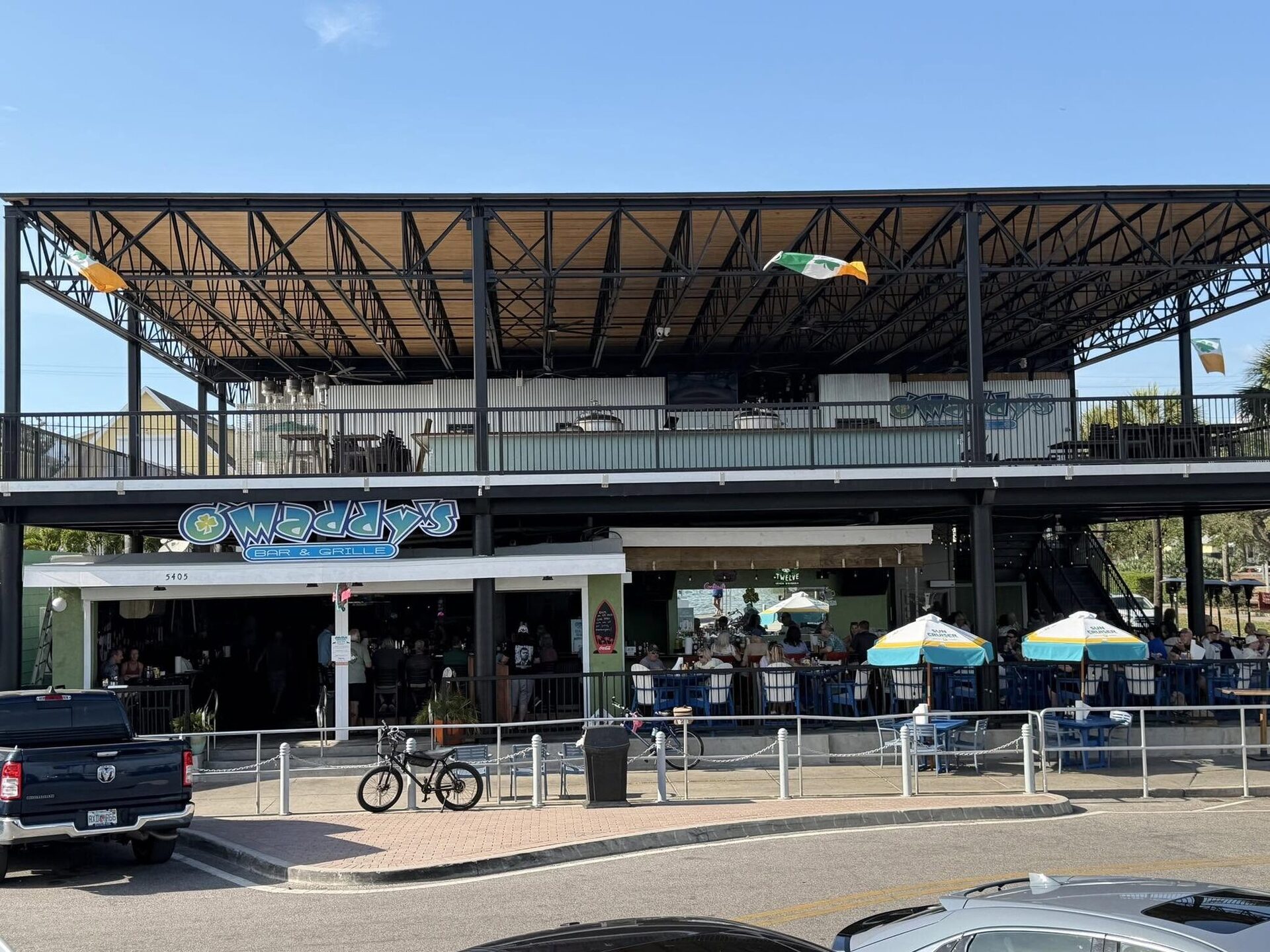 The O'Maddy's building on Shore Blvd S, with its covered upper deck above the patio